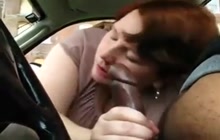 BBW blowing a black cock in the car